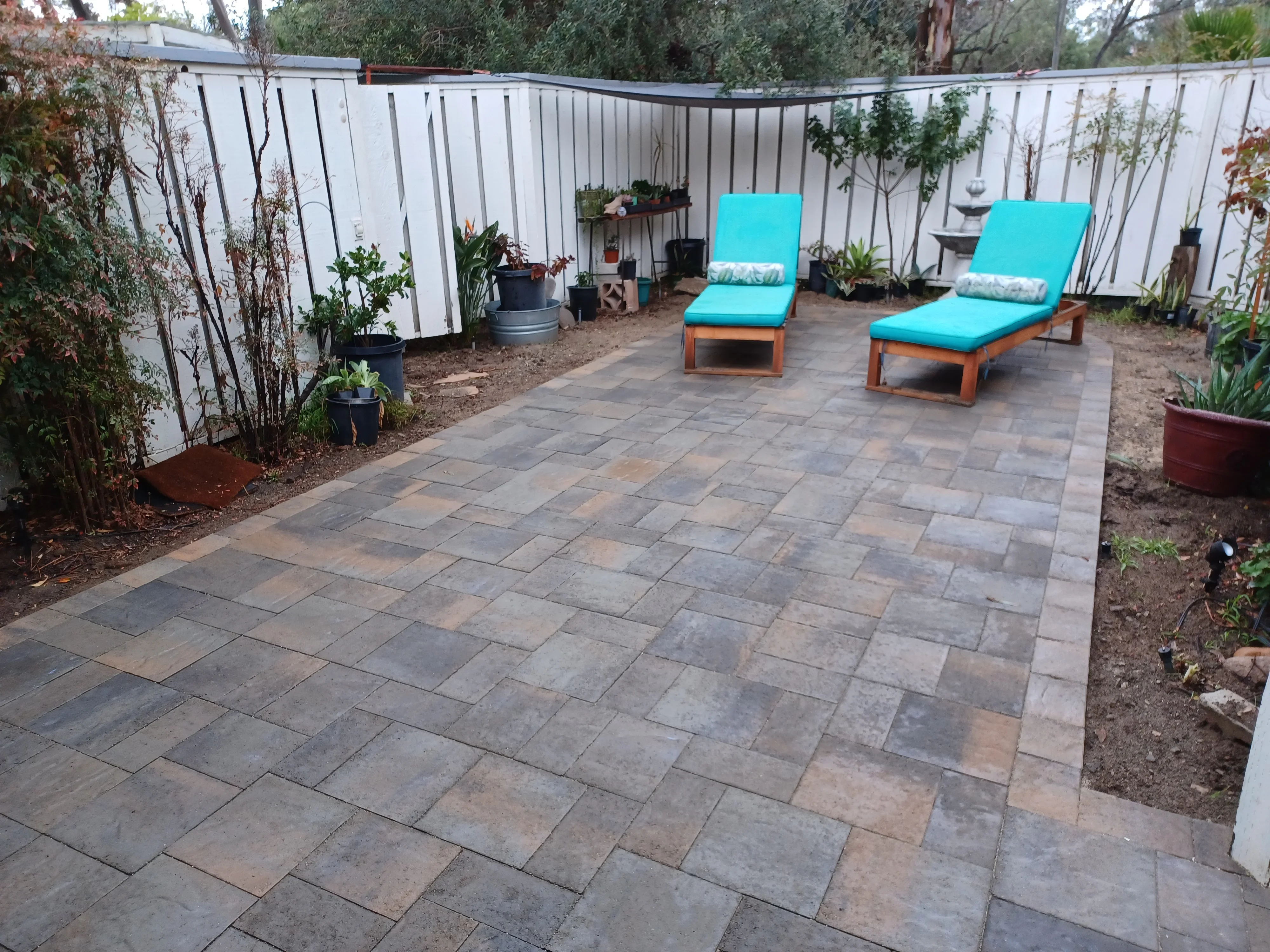 Rectangular paver patio with running bond pattern and lounge seating area