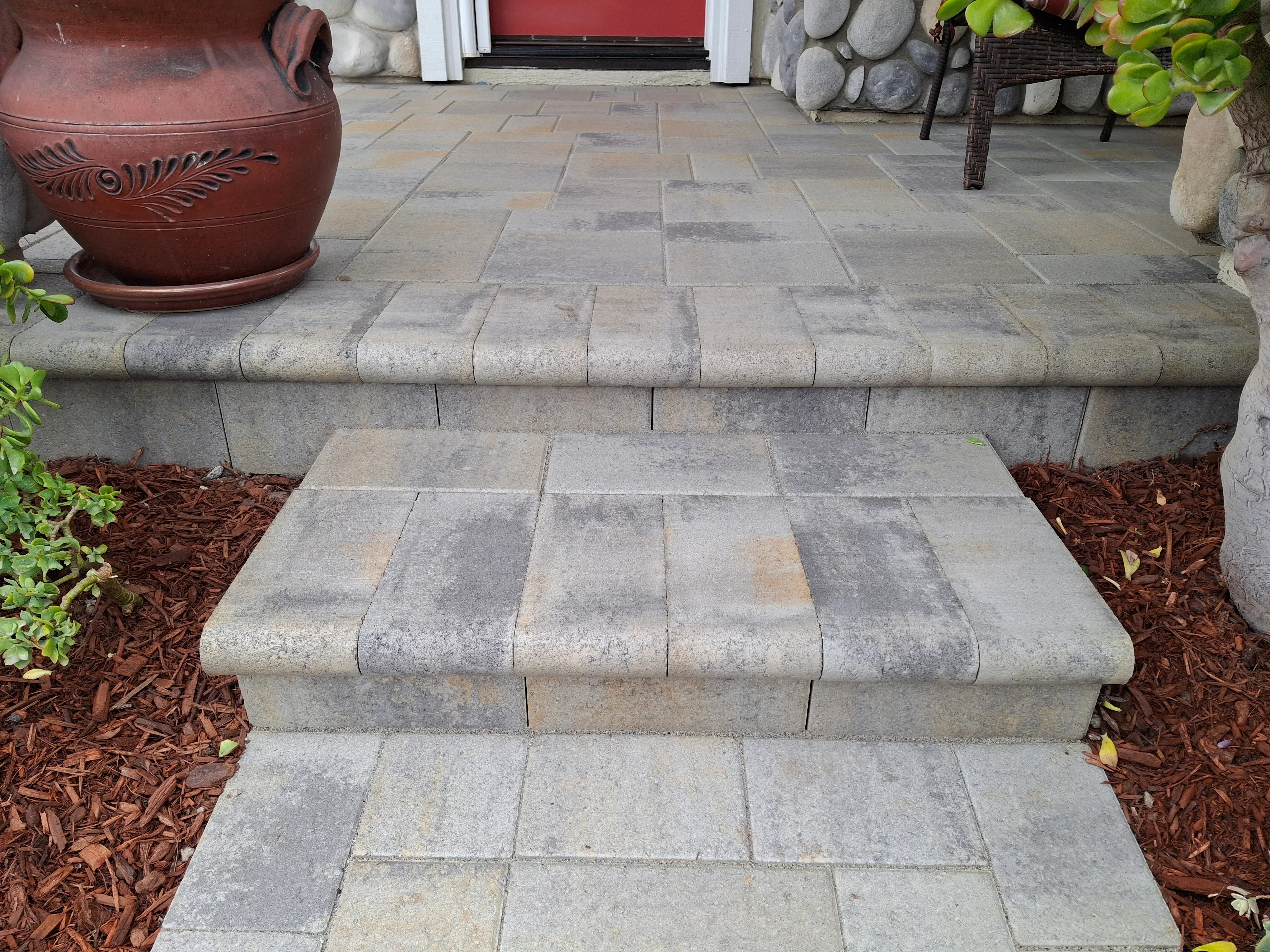 Concrete paver patio with stepped entry and segmental retaining wall blocks